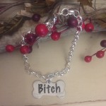 Personalised Dog Bone Necklace BITCH Design<BR>Handmade with Silver-Plated Belcher Chain and Stainless Steel Dog Bone Shaped Tag